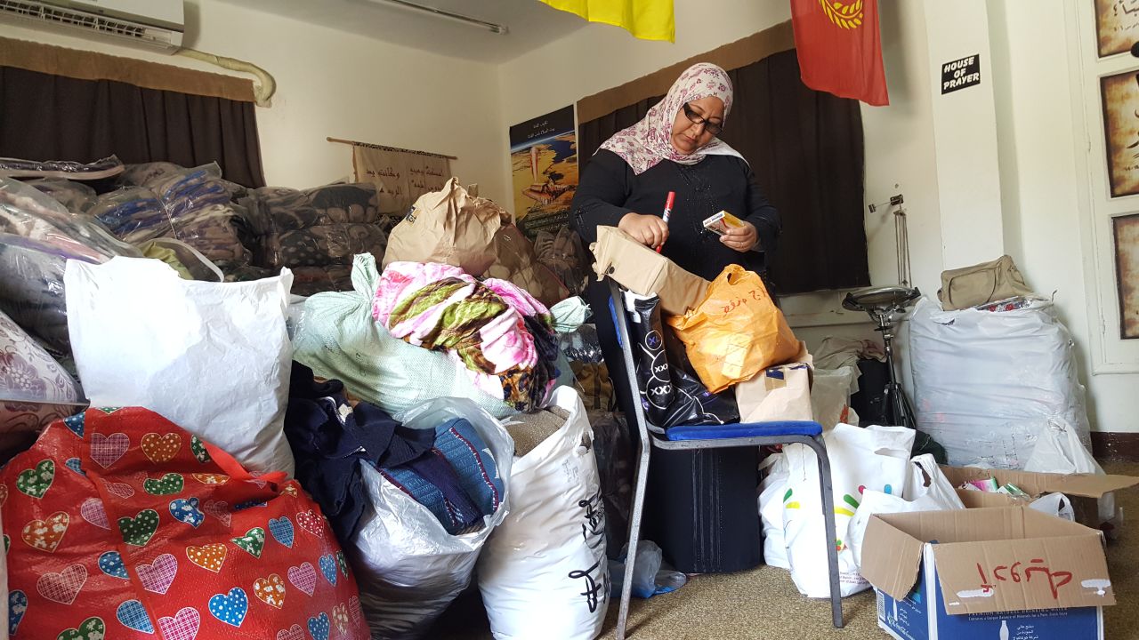 A volunteer sorts out donated medicines at the Evangelical Church in Ismailia.