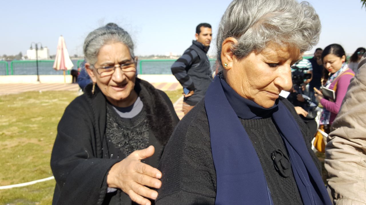 Nabila Halim, pictured right, is consoled by her sister at a government hostel in Ismailia.