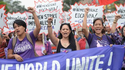 Members of women's group Gabriela march in Manila.