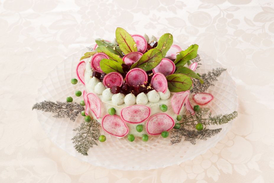 This basil "cake" is stacked with celery, chrysanthemum potato, red cabbage and lotus root, with red turnip, beats, green peas, dill and red sorrel on top.