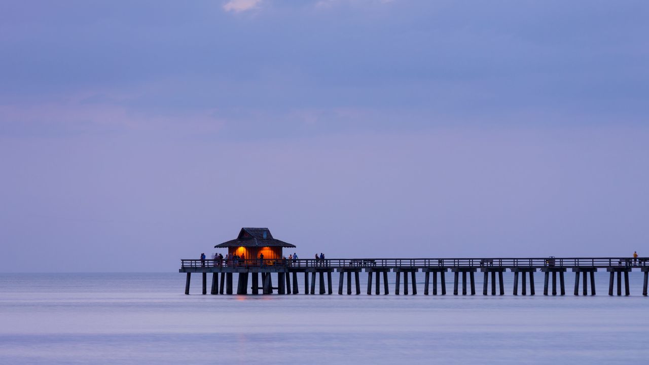 A moody sunset by the pier in the southwest Florida city of  Naples spells out contentment.