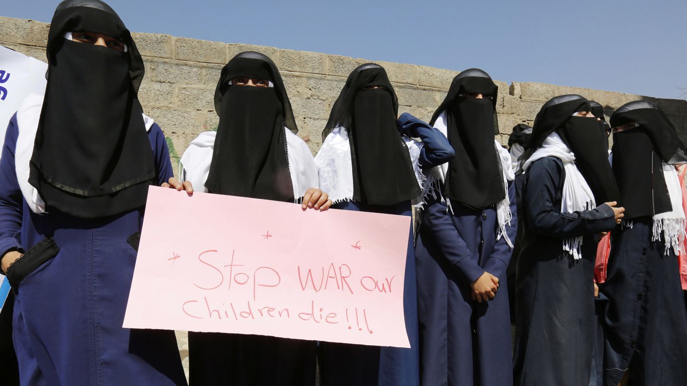 Women hold a banner as they protest in front of the United Nations building in Sanaa, Yemen.