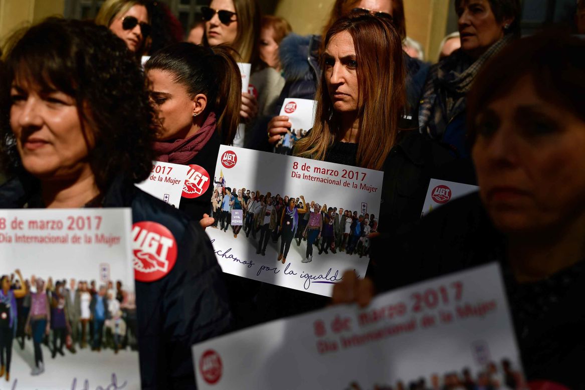 Trade union members show solidarity for female workers outside the union headquarters in Pamplona, Spain.