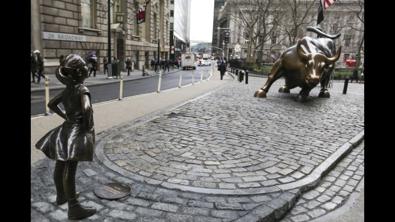 A statue of a defiant girl faces Wall Street's charging bull sculpture in New York. "Fearless Girl" <a href="index.php?page=&url=http%3A%2F%2Fmoney.cnn.com%2F2017%2F03%2F07%2Fnews%2Fgirl-statue-wall-street-bull%2Findex.html" target="_blank">was installed on Tuesday</a> by State Street Global Advisors. The asset manager designed it to call attention to its new initiative to increase the number of women on its clients' corporate boards.