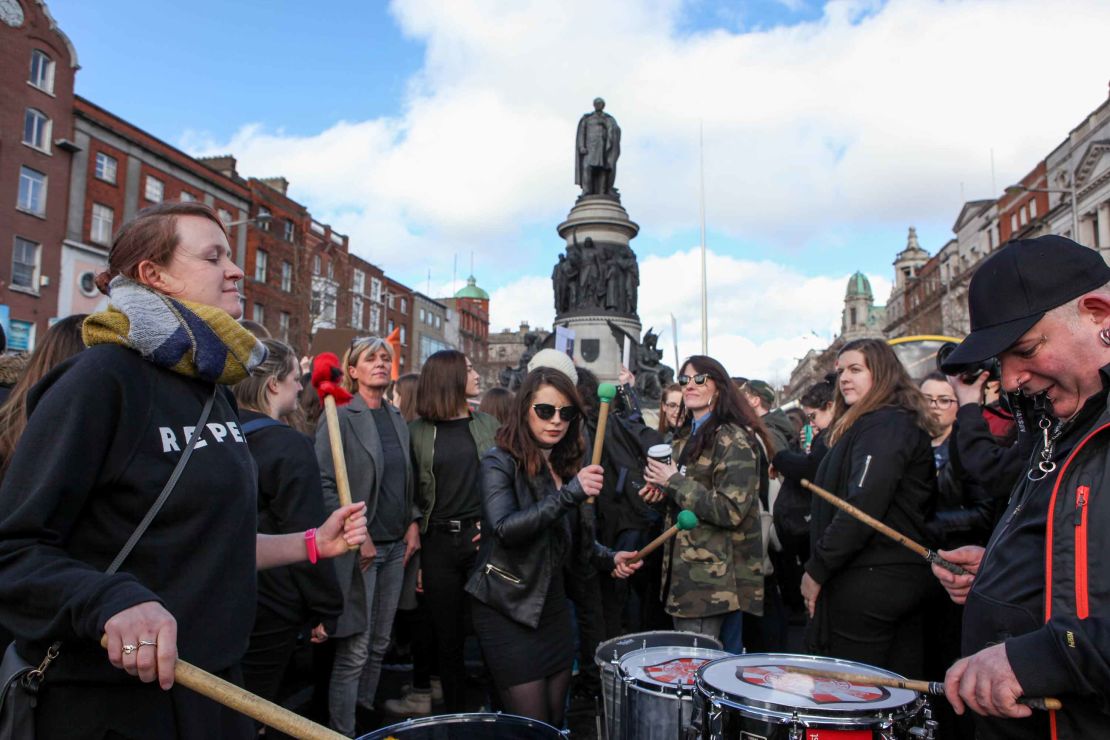 Demonstrators beat drums, pots and pans.