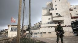 This photo taken on January 25, 2017 shows an Israeli soldier (R) standing guard in the Israeli settlement of Beit El near the West Bank city of Ramallah.
Israel has moved immediately to take advantage of US President Donald Trump's pledges of support, announcing a major settlement expansion that deeply concerns those hoping to salvage a two-state solution with the Palestinians.

 / AFP / - / MENAHEM KAHANA        (Photo credit should read MENAHEM KAHANA/AFP/Getty Images)
