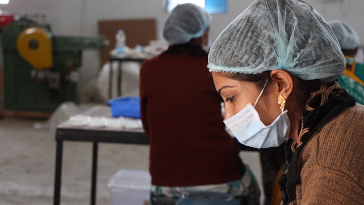 A woman creates compostable sanitary pads from banana fiber, a byproduct of fruit production.