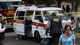 Forensic personnel work at the Virgen de la Asuncion Safe Home, after a fire at the facility killed 20 people in San Jose Pinula, about 30 kilometers east of Guatemala City.
