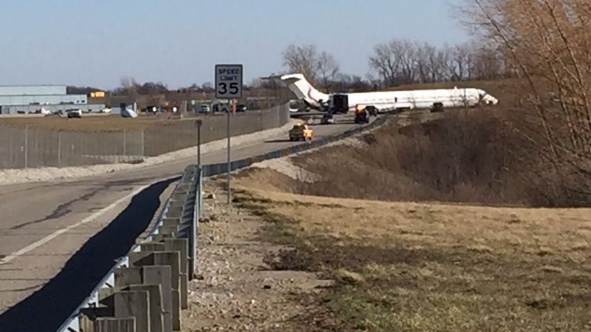 A charter MD83 slid off Runway 23L upon departure from Willow Run Airport at 2:55 Eastern Time this afternoon. The intended destination of the aircraft was Dulles International Airport, Washington DC. The FAA is investigating.