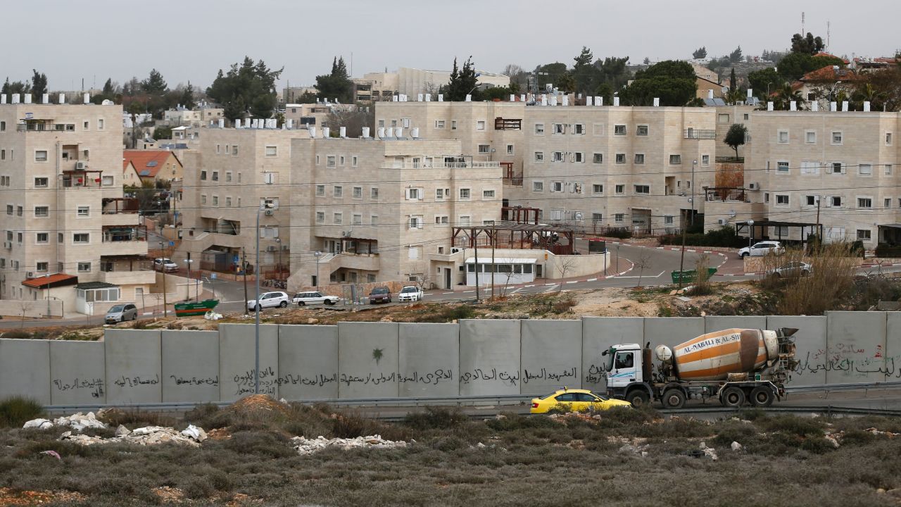 A picture taken from Ramallah shows Israel's separation barrier and Beit El behind it.