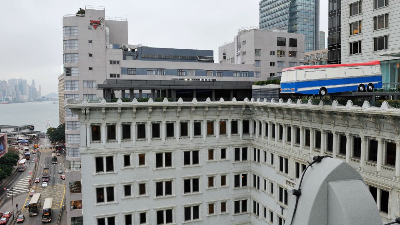 "Hang on a minute, lads, I've got a great idea!" An art installation teeters on the brink of the Peninsula Hotel.