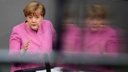 German Chancellor Angela Merkel is reflected in a glass surface during her speech at a session of the German lower house of parliament Bundestag in Berlin on March 9, 2017. 
Chancellor Angela Merkel said that Germany must not allow Turkey to "grow more distant", despite a bitter row in which President Recep Tayyip Erdogan has likened her government to the Nazis. / AFP PHOTO / Tobias SCHWARZ        (Photo credit should read TOBIAS SCHWARZ/AFP/Getty Images)