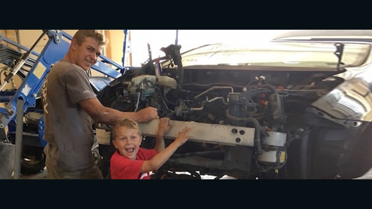 J.T. Parker, 8, seen here with big brother Mason, saved their father after a Toyota Prius fell on him.