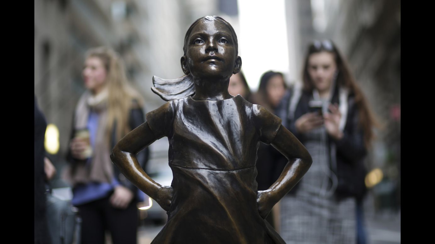 The bronze statue "Fearless Girl" faces off against Wall Street's iconic charging bull sculpture in New York on International Women's Day on Wednesday, March 8. <a href="http://money.cnn.com/2017/03/07/news/girl-statue-wall-street-bull/">State Street Global Advisors installed the "Fearless Girl"</a> in Manhattan's Financial District as part of the asset manager's campaign to increase the number of women on their clients' corporate boards.