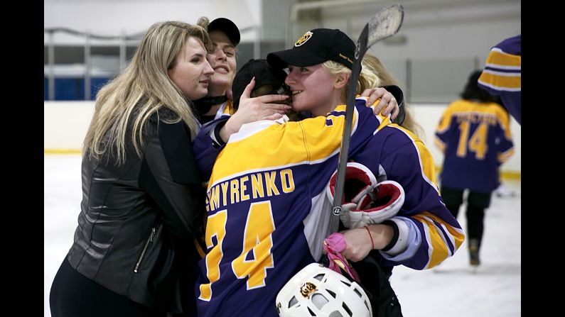 Players and friends congratulate each other.