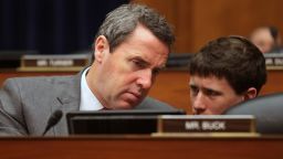 House Committee on Oversight and Government Reform member Rep. Mark Walker, R-N.C., left, speaks to a staff member on Capitol Hill in Washington, Wednesday, June 15, 2016, during the committee's hearing to consider a censure of IRS Commissioner John Koskinen.  (AP Photo/Lauren Victoria Burke)