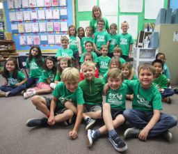 Ryan and his classmates with Ryan's Recycling Company T-shirts.