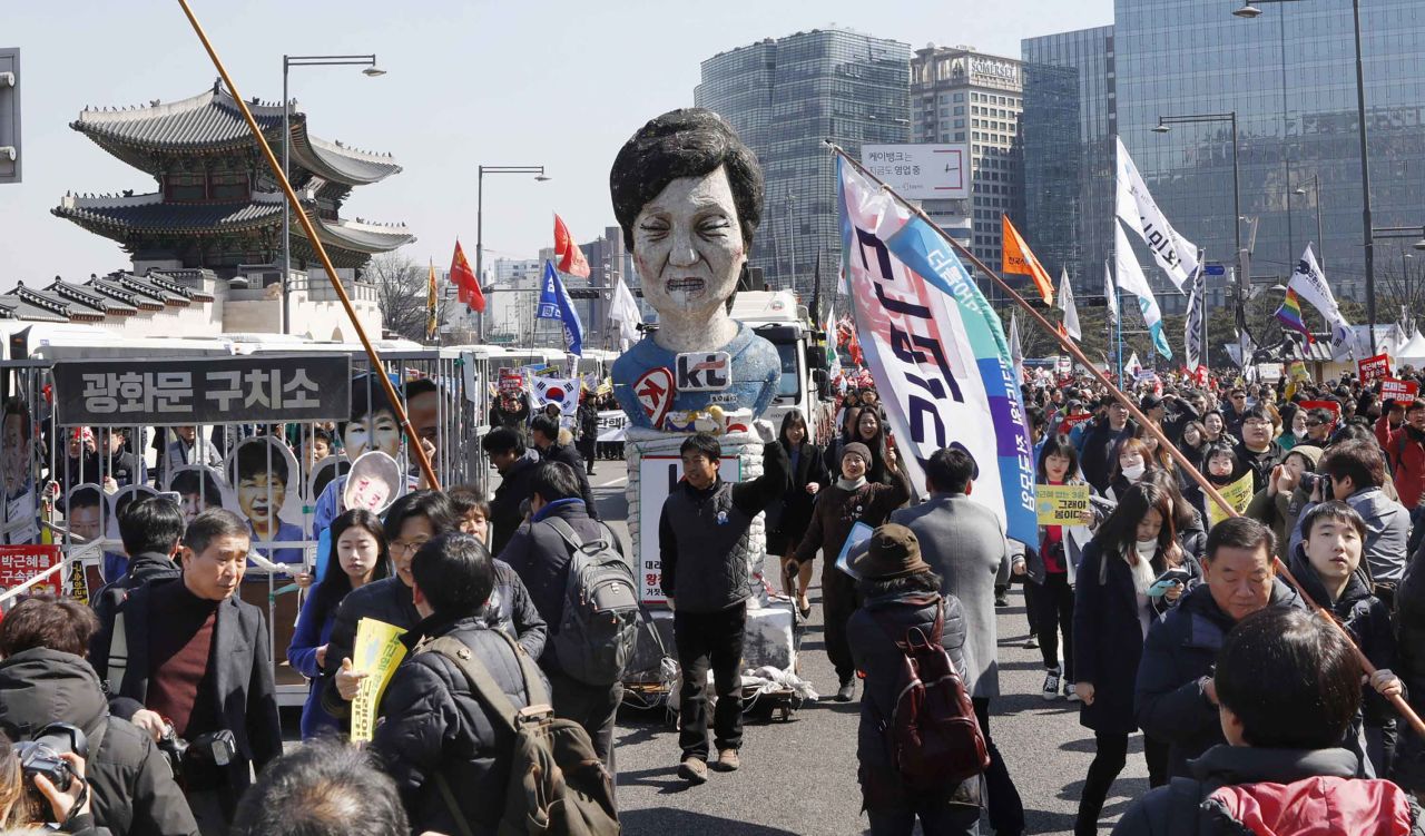 An effigy of Park is paraded through the streets of Seoul.