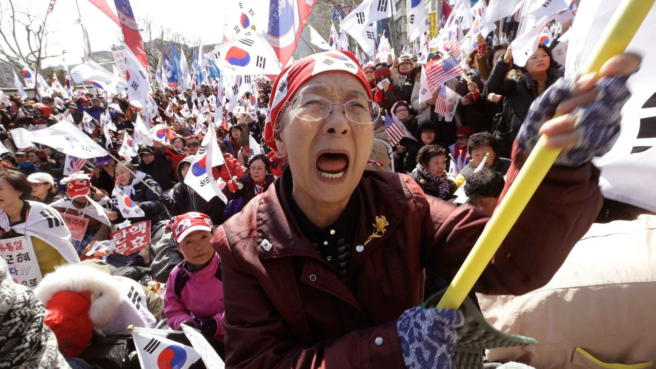 A supporter of South Korean President Park Geun-hye cries during a rally opposing her impeachment.