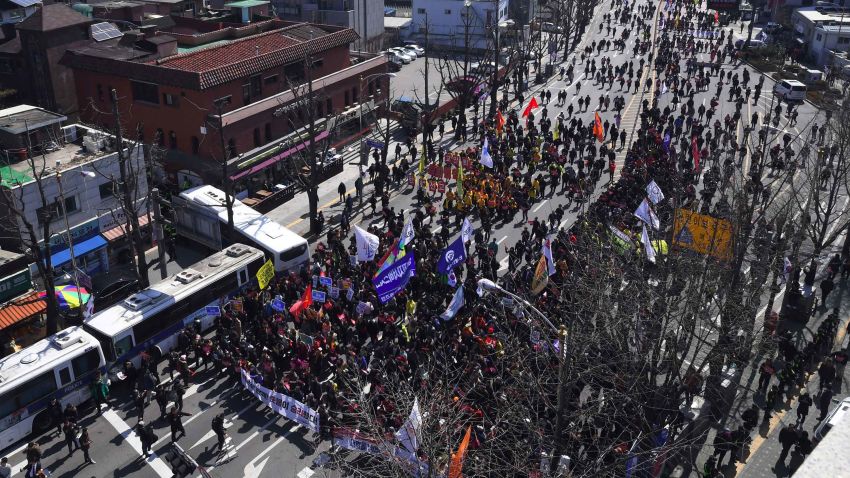 Anti-government activists march toward the presidential Blue House after the announcement of the Constitutional Court's decision to uphold the impeachment of South Korea's President Park Geun-Hye in Seoul on March 10, 2017.South Korean President Park Geun-Hye was fired by the country's top court on March 10, as it upheld her impeachment by parliament over a wide-ranging corruption scandal. / AFP PHOTO / JUNG Yeon-Je        (Photo credit should read JUNG YEON-JE/AFP/Getty Images)