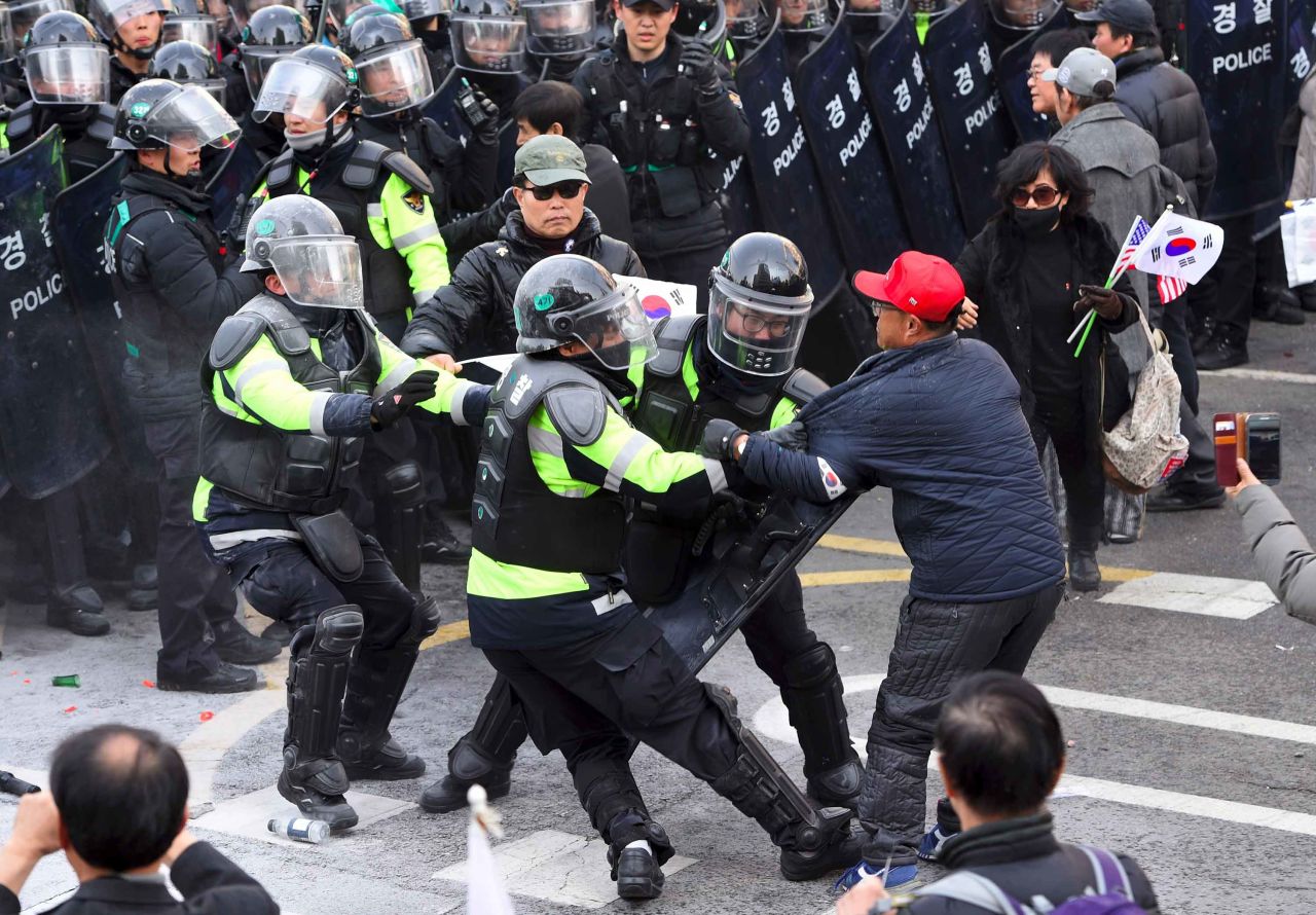 Park supporters clash with police after the country's Constitutional Court announced it would uphold her impeachment.