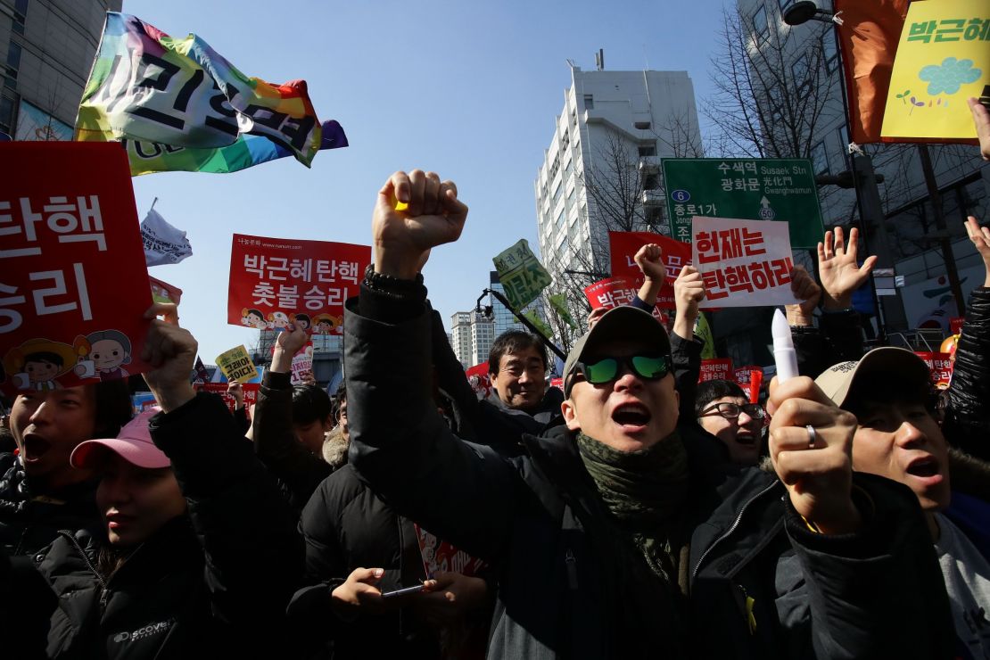South Koreans celebrate after hearing the Constitutional Court's verdict on March 10, 2017 in Seoul, South Korea. 