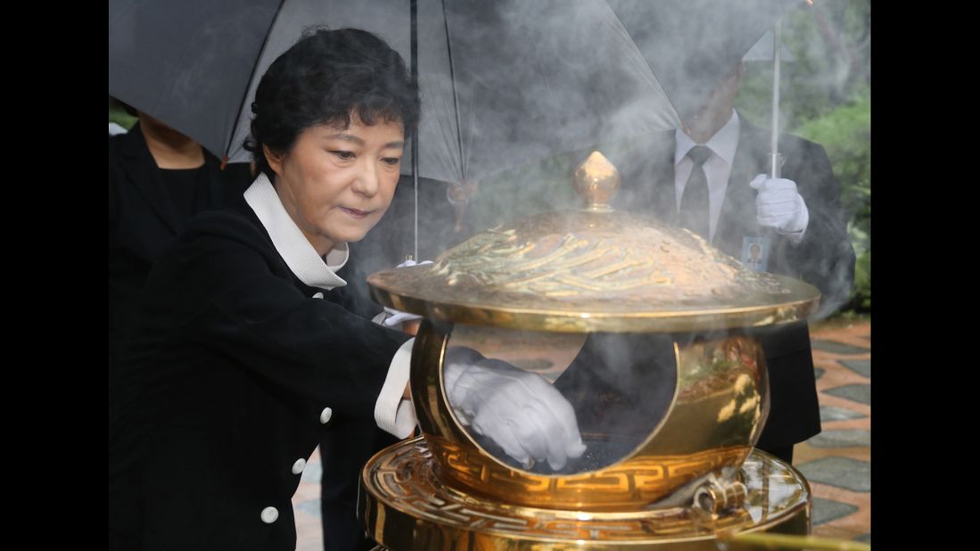 Park burns incense at the tomb of her father in August 2012, soon after she was named the presidential candidate for the ruling Saenuri Party.