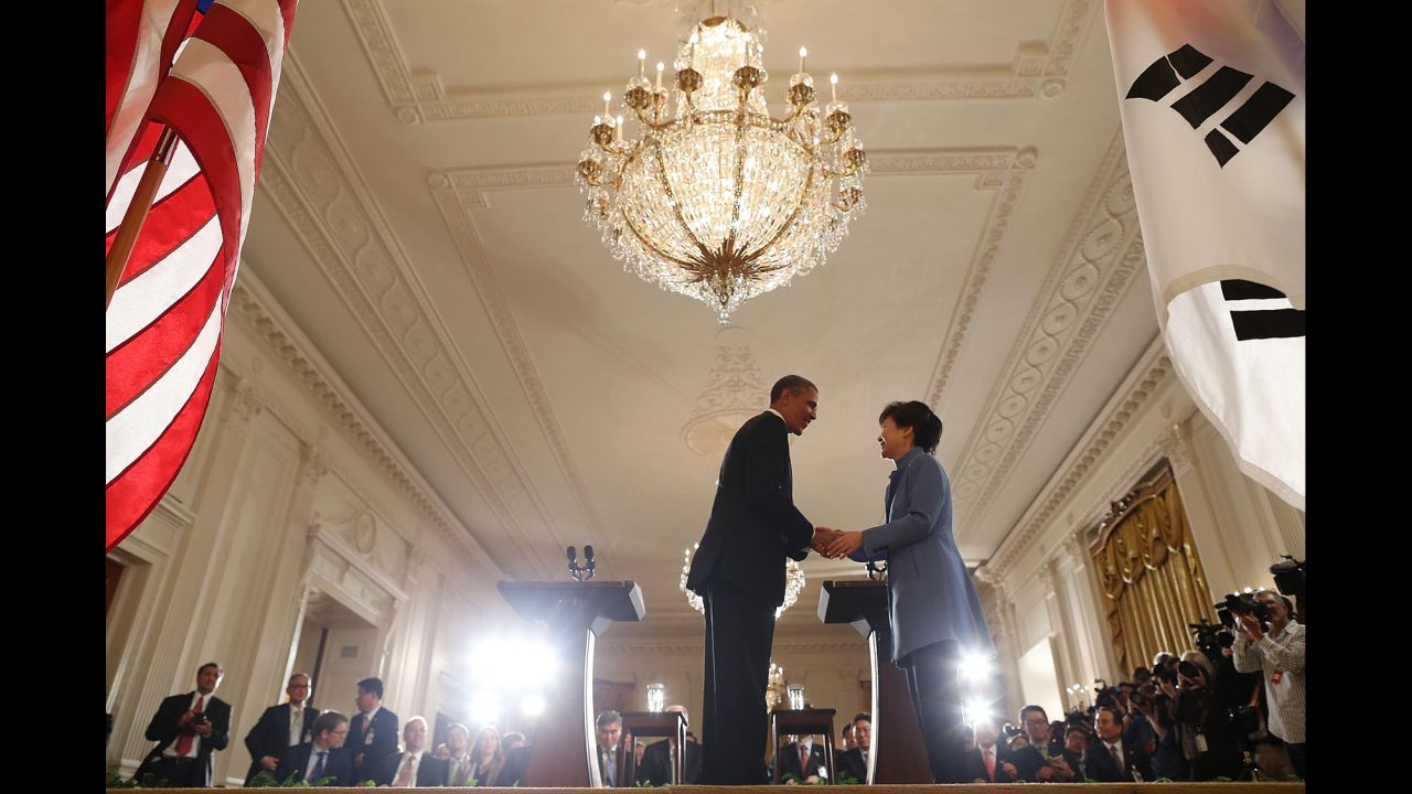 Park shakes hands with US President Barack Obama during a White House news conference in May 2013.