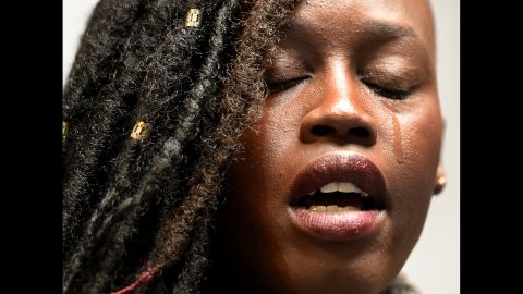 Elizabeth Arjok, a Sudanese immigrant, sheds a tear Monday, March 6, as she speaks before the start of a news conference by the New York Immigration Coalition. <a href="http://www.cnn.com/2017/03/06/politics/trump-travel-ban-iraq/index.html" target="_blank">A revised travel ban</a> was signed earlier that day by US President Donald Trump. The executive order, which temporarily stops immigration from six countries and reinstates a ban on all refugees, "breaks my heart," Arjok said at the news conference. She fled the war in Sudan when she was 7, <a href="http://www.wnyc.org/story/3-stories-new-yorkers-affected/" target="_blank" target="_blank">according to radio station WNYC.</a>