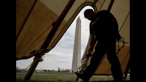 Aldo Seoane helps set up teepees near the Washington Monument on Tuesday, March 7. He was with a group of Native Americans protesting construction of the Dakota Access Pipeline.