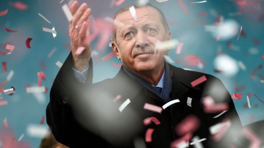 Turkish President Recep Tayyip Erdogan gestures amid confetti during a rally in Istanbul on March 11, 2017. Erdogan threatened to retaliate after the Netherlands banned the foreign minister from flying in for a campaign rally, as he said The Hague's behavior was reminiscent of Nazism.