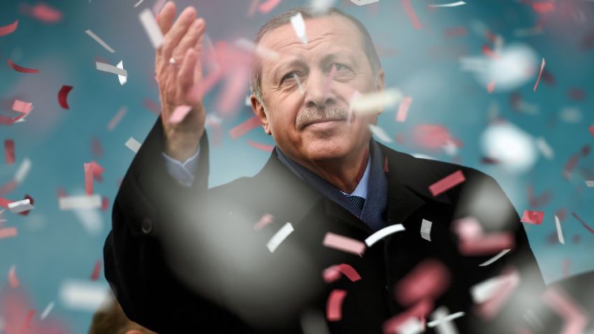 Turkish President Recep Tayyip Erdogan gestures amid confetti during a rally in Istanbul on March 11, 2017. Erdogan threatened to retaliate after the Netherlands banned the foreign minister from flying in for a campaign rally, as he said The Hague's behavior was reminiscent of Nazism. 