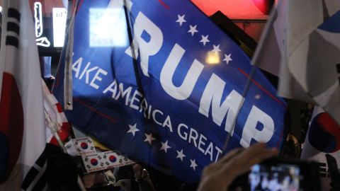 Park supporters wave a Donald Trump campaign flag. "We want to make Korea great again," they said.