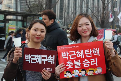 "Today is just the beginning," said Kim Ga-hyun, 26 (left). Her friend Kim Bo-hee, 24, said that after months of protests, it was good to have a "day of celebration." 