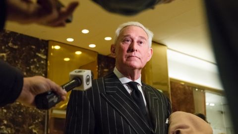 Conservative lobbyist and consultant Roger Stone speaks with the press in the lobby of Trump Tower in New York, New York, following a meeting there on December 6, 2016.