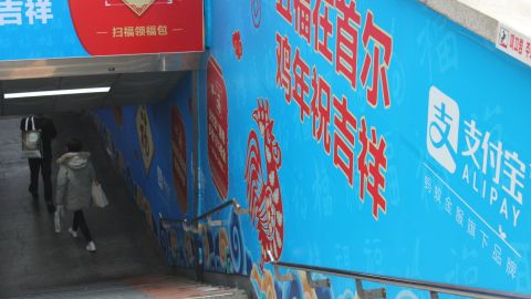 A Chinese advert for payment app Alipay in an underground shopping market in Seoul. Visits by Chinese tourists to South Korea are down after a dispute over a controversial missile defense system.