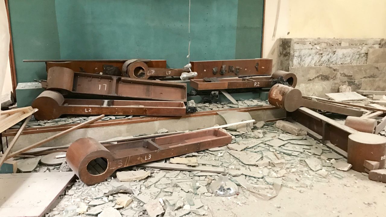 Wooden display stands lie on the floor of the Mosul Museum. The museum artifacts were looted and destroyed by ISIS in February 2015. Officials say ISIS smuggled some of the artifacts out of Iraq to sell on the black market.
