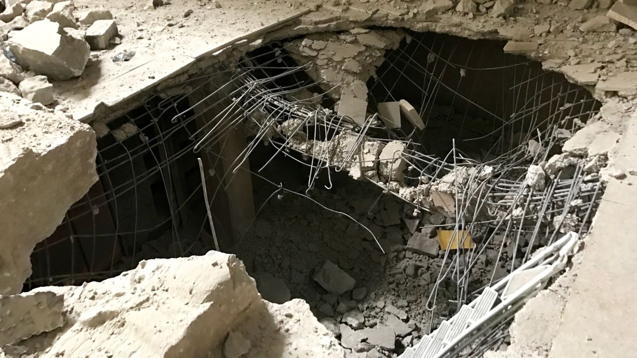 A large hole in the middle of the floor of the museum was left when ISIS  used explosives to access artifacts that were not on display. 