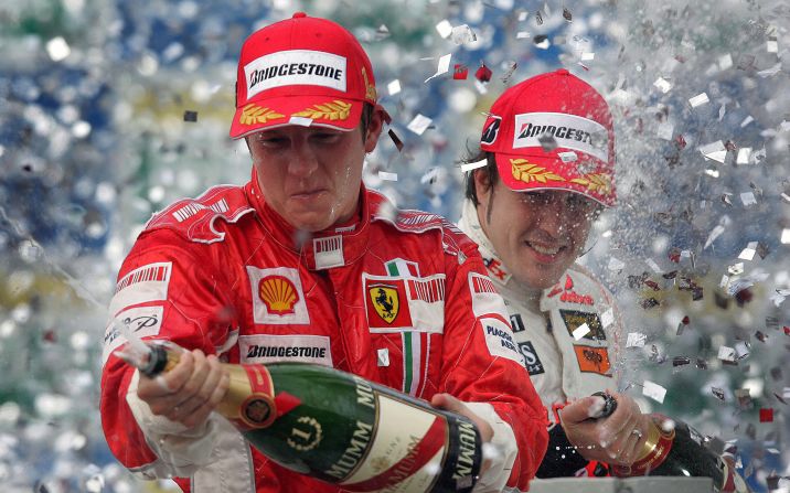 Raikkonen (left) and Spain's Fernando Alonso spray champagne on the podium at the 2007 Brazilian Grand Prix where the Finn clinched his maiden world crown.