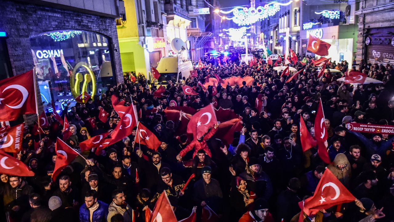 Protestors wave Turkish flags outside the Dutch consulate in Istanbul, March 11.