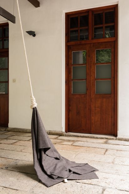 Wong's eerie installation dangles a blanket from colonial-era Britain from a thick knotted rope, dragging it back and forth along the ground using a motor. It's a commentary on Asia Society Hong Kong's location, which was built on a former British armory.