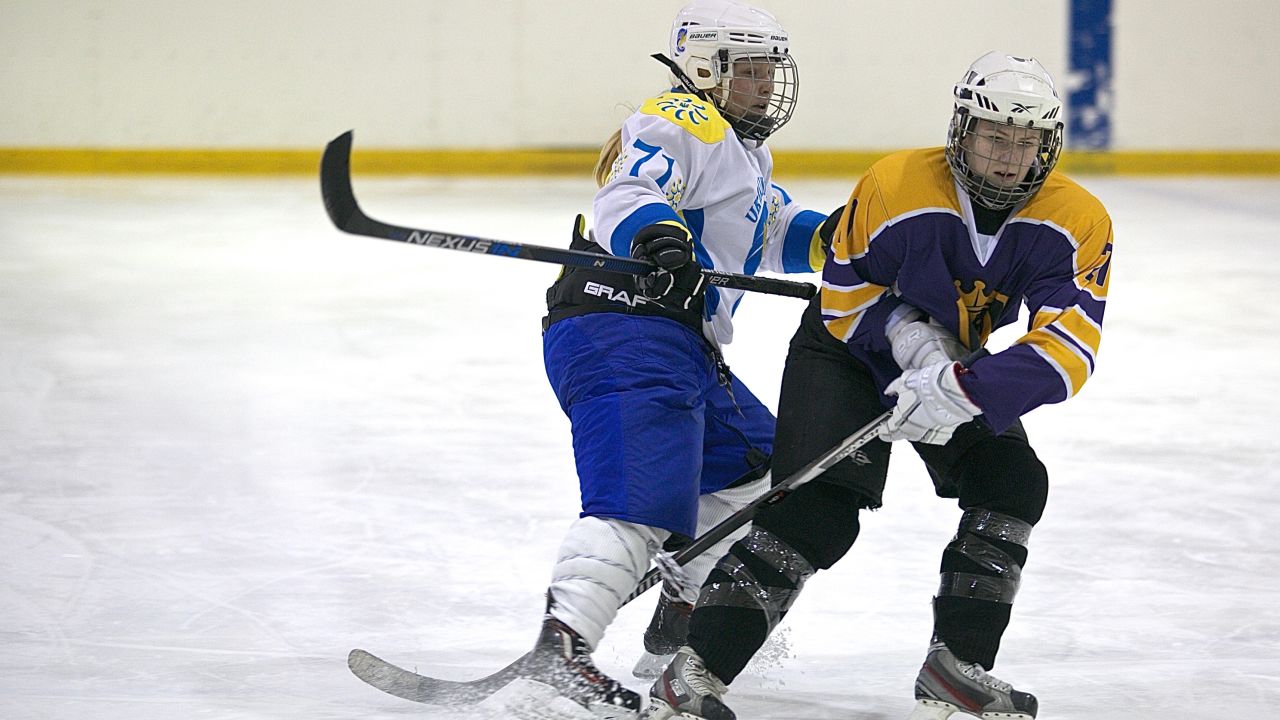 Canadian Kelly Whelan (left) of Kyiv Ukrainochka, vies with Belarussian player Katerina Rudchenko.