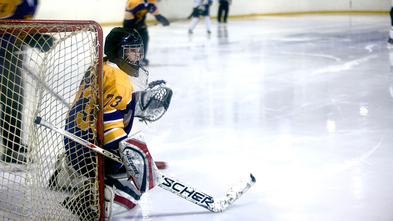 The Dnipro Queens goalie defends a shot.
