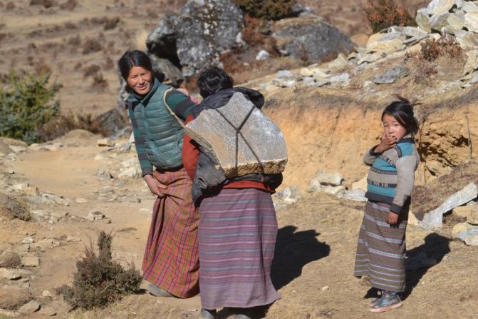 <strong>Laya Valley: </strong>The Layap people of the valley are semi-nomadic herders who depend on their yaks for meat, cheese, clothing and more. The women do much of  the backbreaking laboring work. 