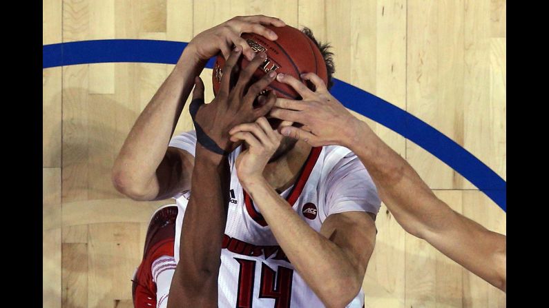 Louisville forward Anas Mahmoud has his shot blocked during an ACC Tournament game against Duke on Thursday, March 9. 