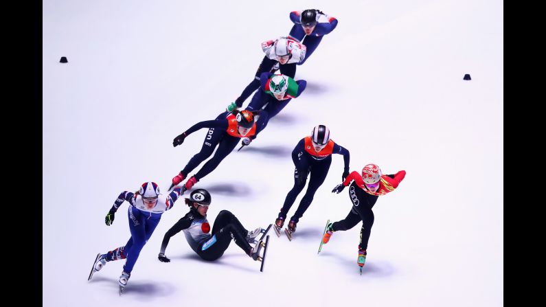 Sumire Kikuchi, a short-track speedskater from Japan, falls during a 1,500-meter race at the World Championships on Saturday, March 11.<br />