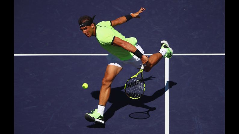 Rafael Nadal plays a backhand volley during a second-round match at the BNP Paribas Open, a tournament in Indian Wells, California, on Sunday, March 12. Nadal defeated Guido Pella in straight sets.