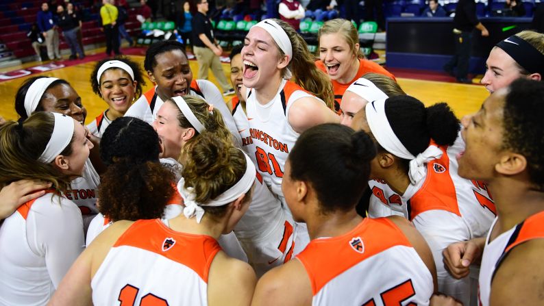 Princeton's basketball team celebrates after winning its Ivy League semifinal against Harvard on Saturday, March 11.