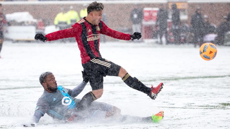 Atlanta United's Hector Villalba is tackled by Minnesota United's Jermaine Taylor during a Major League Soccer match Sunday, March 12. Atlanta won 6-1, ruining Minnesota's first home match since joining MLS. It was 20 degrees at kickoff, tying the coldest match in league history.<br />