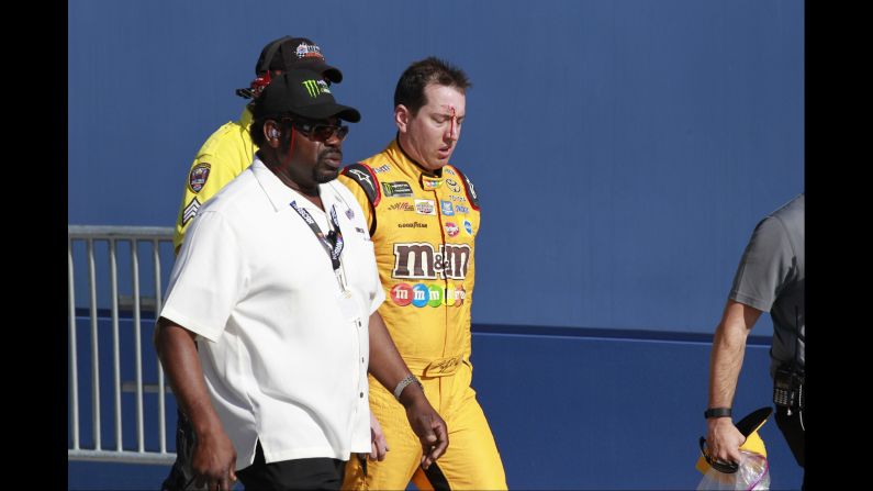 NASCAR driver Kyle Busch bleeds from the forehead after getting in a post-race scrum with Joey Logano and Logano's crew on Sunday, March 12. Busch attacked Logano following the Cup Series race at Las Vegas Motor Speedway. He was upset with being spun out during the race. <br />